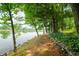 Picturesque lakeside scenery with a lush, tree-lined shoreline at 3695 Windsor Pl, Martinsville, IN 46151