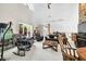 Cozy living room features stone wall, vaulted ceiling, and comfortable seating at 3695 Windsor Pl, Martinsville, IN 46151