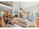Spacious living room with stone fireplace, wood floors and staircase access at 3695 Windsor Pl, Martinsville, IN 46151
