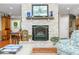 Cozy living room showcasing a stone fireplace, neutral paint, and comfortable seating at 3695 Windsor Pl, Martinsville, IN 46151