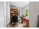 Functional home office space with built-in desk, natural light, and ample shelving at 3695 Windsor Pl, Martinsville, IN 46151