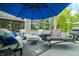 Outdoor patio featuring stone accents, an array of furniture, and a serene outdoor ambiance at 3695 Windsor Pl, Martinsville, IN 46151
