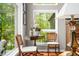 Bright sitting area with large windows, hardwood floors, and serene views at 3695 Windsor Pl, Martinsville, IN 46151