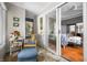 Cozy sun room with comfortable seating and large sliding glass doors overlooking the main bedroom inside at 3695 Windsor Pl, Martinsville, IN 46151