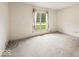 Bedroom featuring neutral carpeting, a large window, and white walls at 3714 Timberview Ct, Anderson, IN 46011