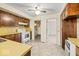 Kitchen featuring wooden cabinets, laminate countertops, and a ceiling fan at 3714 Timberview Ct, Anderson, IN 46011
