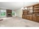 This spacious living room has a fireplace and beautiful built-ins for storage and decor at 3714 Timberview Ct, Anderson, IN 46011