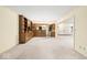 Spacious living room featuring built-in wooden shelving and neutral carpeting at 3714 Timberview Ct, Anderson, IN 46011