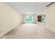 Bright living room with neutral walls, carpet, and large windows providing lots of natural light at 3714 Timberview Ct, Anderson, IN 46011