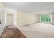 Spacious living room featuring plush carpeting, a large picture window, and ample natural light at 3714 Timberview Ct, Anderson, IN 46011
