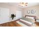 A charming bedroom with hardwood floors, neutral walls, and modern furniture and decor at 4291 Washington Blvd, Plainfield, IN 46168