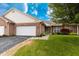 Charming brick home featuring an attached two car garage, a well-manicured lawn, and beautiful landscaping at 4291 Washington Blvd, Plainfield, IN 46168