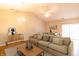 Bright living room featuring hardwood floors, a vaulted ceiling, and contemporary furnishings at 4291 Washington Blvd, Plainfield, IN 46168