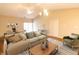 Spacious living room with vaulted ceiling, hardwood floors, ceiling fan, and neutral tones at 4291 Washington Blvd, Plainfield, IN 46168