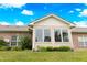 View of an enclosed sun room addition with large windows that offer ample natural light and backyard views at 4291 Washington Blvd, Plainfield, IN 46168