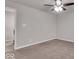 A cozy bedroom featuring neutral carpet, ceiling fan, and a doorway to another room at 4416 Eaglecrest Pl, Zionsville, IN 46077