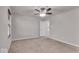 Bedroom featuring neutral carpet, ceiling fan, a window with blinds, and a white door at 4416 Eaglecrest Pl, Zionsville, IN 46077