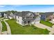 Beautiful two-story home with a landscaped front yard, two-car garage, and a welcoming front porch at 4416 Eaglecrest Pl, Zionsville, IN 46077