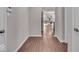 Hallway features wood-style floors and leads into an open living space with natural light and contemporary decor at 4416 Eaglecrest Pl, Zionsville, IN 46077