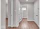 Hallway featuring hardwood floors and white doors at 4416 Eaglecrest Pl, Zionsville, IN 46077