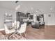 A modern kitchen with stainless steel appliances, dark cabinets, and a large island with bar stool seating at 4416 Eaglecrest Pl, Zionsville, IN 46077