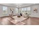 Spacious living room with comfortable seating, large windows, and neutral tones, creating a welcoming atmosphere at 4416 Eaglecrest Pl, Zionsville, IN 46077