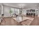 Spacious living room with hardwood floors and an open floor plan leading to kitchen at 4416 Eaglecrest Pl, Zionsville, IN 46077