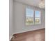 Bright bedroom with laminate floors, modern lighting, and large windows at 4416 Eaglecrest Pl, Zionsville, IN 46077