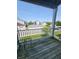 Balcony overlooking community with a metal railing and wooden floor at 5011 Amber Creek Pl # 205, Indianapolis, IN 46237