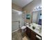 Bathroom featuring a shower with glass doors, a toilet and a wood vanity with sink at 5011 Amber Creek Pl # 205, Indianapolis, IN 46237