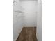 Walk-in closet with metal racks for organization and clean, white walls at 5011 Amber Creek Pl # 205, Indianapolis, IN 46237