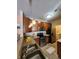 Well-equipped kitchen with stainless steel appliances, warm cabinetry and stainless steel sink at 5011 Amber Creek Pl # 205, Indianapolis, IN 46237