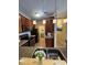 Contemporary kitchen featuring stainless steel appliances and rich wooden cabinetry at 5011 Amber Creek Pl # 205, Indianapolis, IN 46237