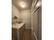 Functional laundry room with washer, dryer, storage shelf and neutral tile flooring at 5011 Amber Creek Pl # 205, Indianapolis, IN 46237