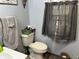 Bathroom with a neutral color scheme, toilet, and towel rack at 5091 Alexandria Pike, Anderson, IN 46012