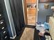 View of the entryway to the kitchen with wood cabinets and natural light at 5091 Alexandria Pike, Anderson, IN 46012