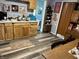 Spacious eat in kitchen with wood cabinets and floors, lots of natural light and stainless steel appliances at 5091 Alexandria Pike, Anderson, IN 46012