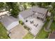 Aerial view of deck with outdoor dining, basketball court, and back of home's gray siding at 5110 S State Ave, Indianapolis, IN 46227