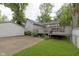 Spacious backyard with a back deck, garage, and a grassy area at 5110 S State Ave, Indianapolis, IN 46227