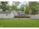 A large backyard area with a garage and basketball hoop at 5110 S State Ave, Indianapolis, IN 46227