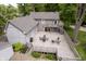 Aerial photo of wooden deck, outdoor grill and dining furniture, and side view of backyard at 5110 S State Ave, Indianapolis, IN 46227