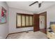 Comfortable room featuring a large window and neutral walls, offering a bright and relaxing atmosphere at 5110 S State Ave, Indianapolis, IN 46227