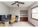 Cozy bedroom with built-in shelving and a ceiling fan, providing a comfortable and organized living space at 5110 S State Ave, Indianapolis, IN 46227