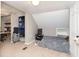 Carpeted bedroom with angled ceiling features built in shelving and carpet at 5110 S State Ave, Indianapolis, IN 46227