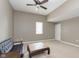 Neutral bedroom features a vaulted ceiling, carpet, sofa, and a center table at 5110 S State Ave, Indianapolis, IN 46227