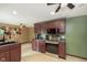 Well-equipped kitchen with stainless steel appliances, tile flooring, and ample cabinet space, ideal for cooking at 5110 S State Ave, Indianapolis, IN 46227