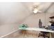 Office features a ceiling fan and a large table with office chair at 5110 S State Ave, Indianapolis, IN 46227