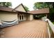 Expansive wooden deck with outdoor entertaining area, ideal for relaxation and gatherings at 5116 W County Road 450 S, Coatesville, IN 46121