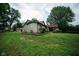 View of backyard and back of the house, with deck, patio cover, trampoline and garage in view at 5116 W County Road 450 S, Coatesville, IN 46121