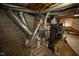 Basement with the home's utilities, unfinished walls and ceiling, and room for storage at 5116 W County Road 450 S, Coatesville, IN 46121